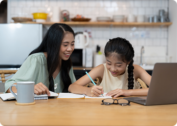 Primary school tutor teaching child at home